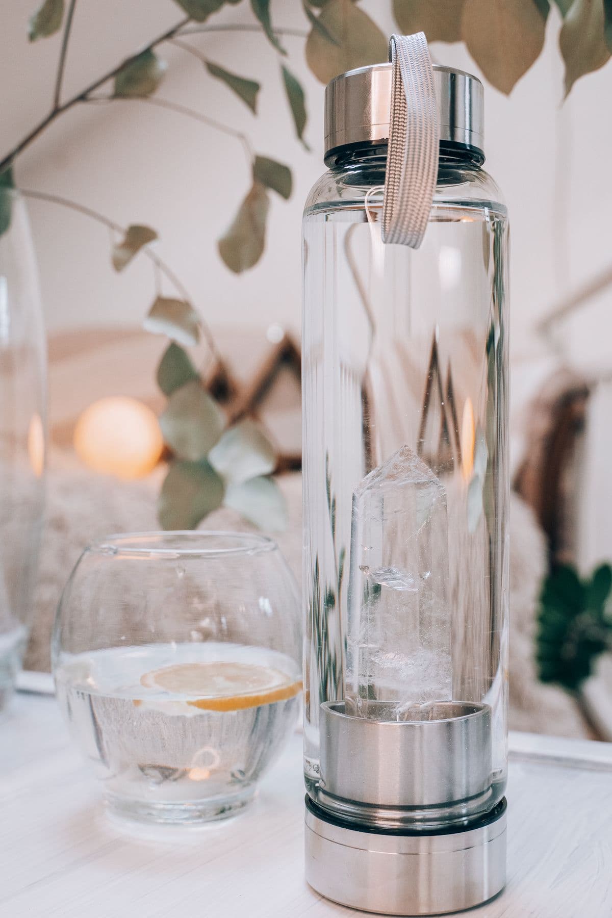 Clear glass vessels and eucalyptus in soft daylight